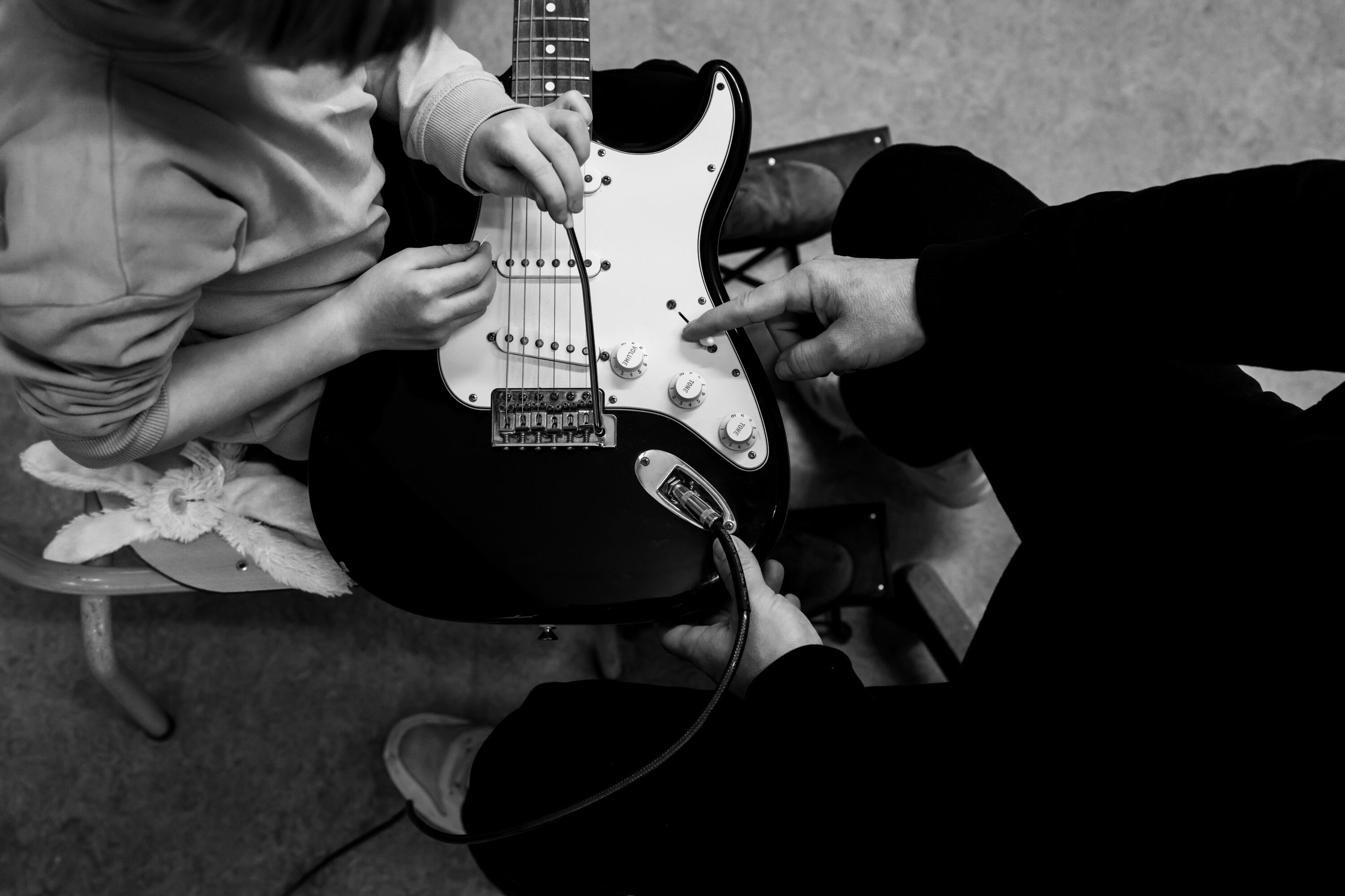 Documentaire fotografie bij de muziekschool Zeeland, met focus op gitaarlessen